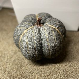✨Grey felt pumpkin decor wirh gold stitching and a brown stem.